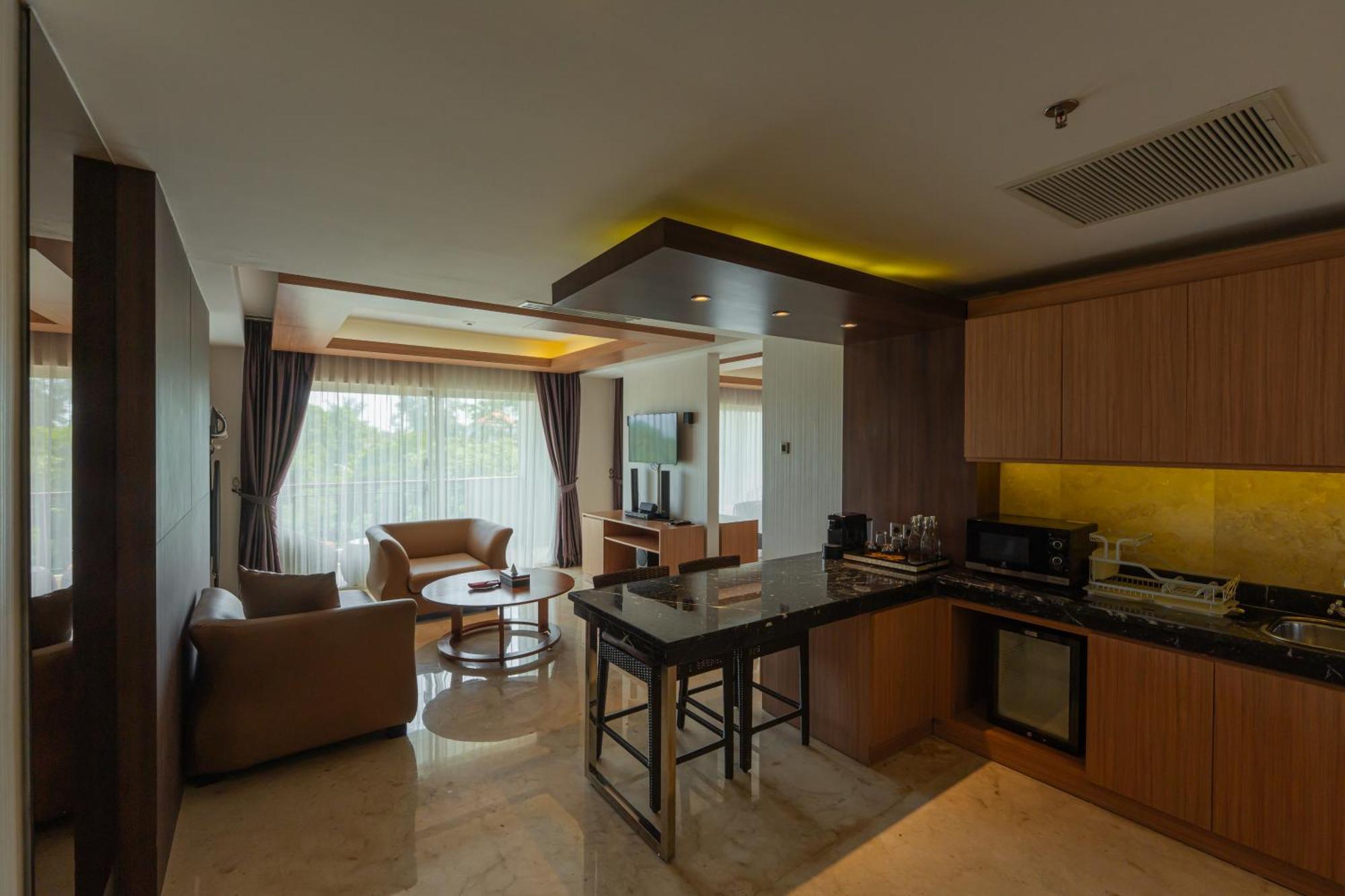 Jungle Suite Room Balcony River View daily shuttle to Ubud City Photo Session Art Gallery Visit 24-hour access to Fitness Center Welcome Drink Kids Activities