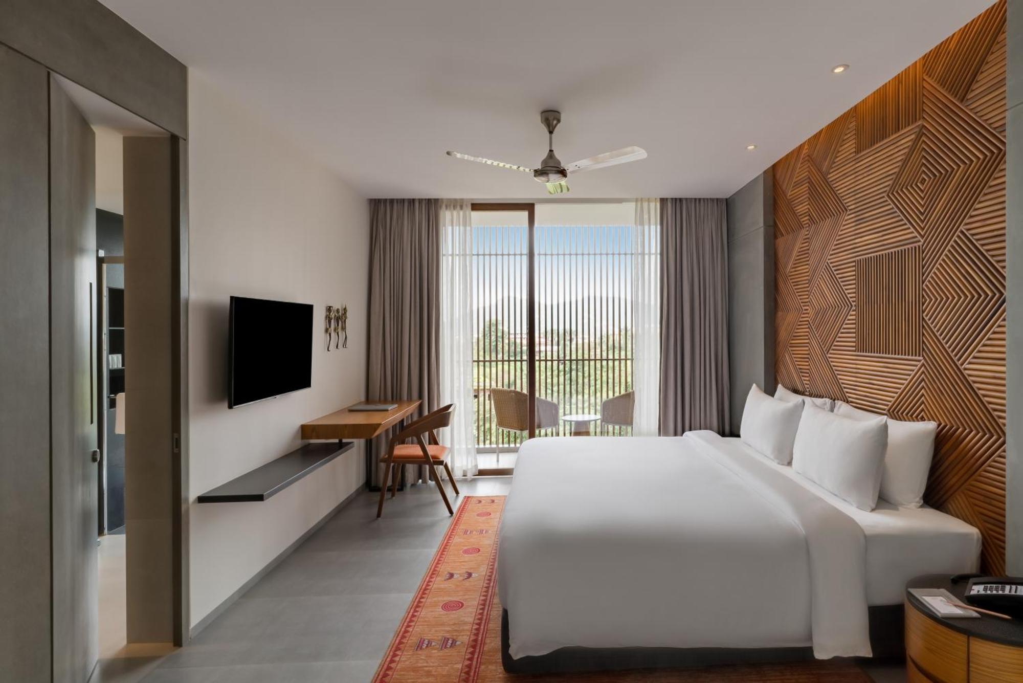 Deluxe Room with Balcony with 1+1 happy hours in Malhari from 12pm to 8pm and Complimentary in-stay Hotel Credit worth INR 500 redeemable on Spa per stay